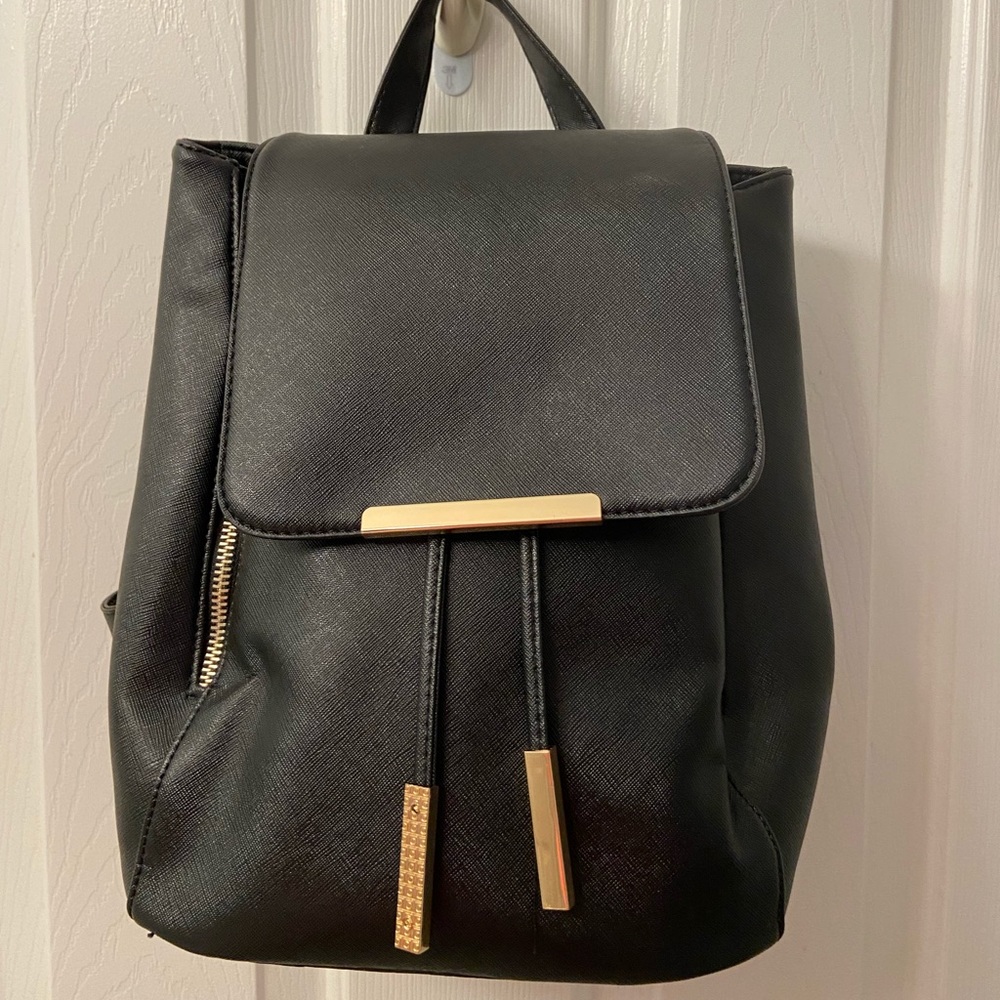 Black backpack with gold accents